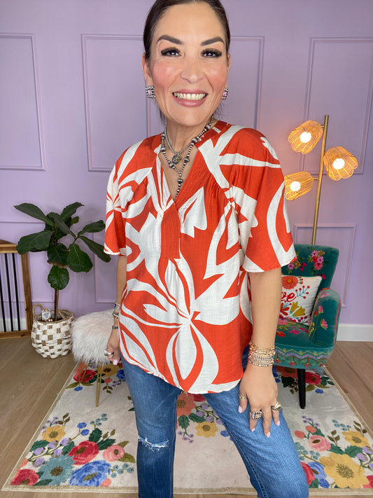 Leaf Print V-Neck Top with a Snap Closure and Trapunto Stitching