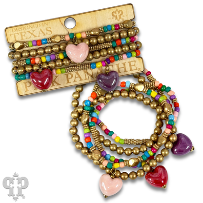 Multi-color bracelet with three heart charms