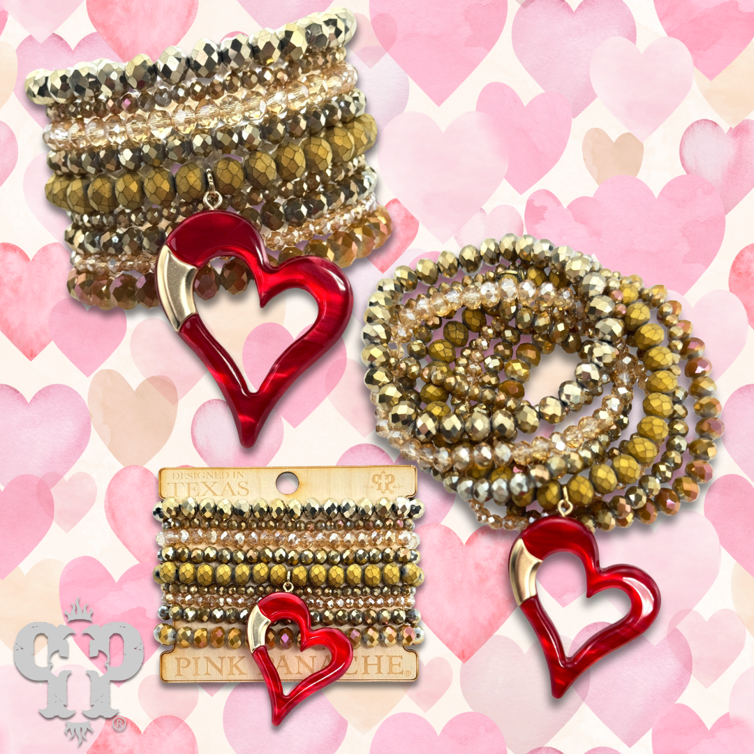 Nine strand bracelet set with red heart charm