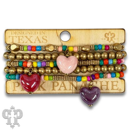 Multi-color bracelet with three heart charms
