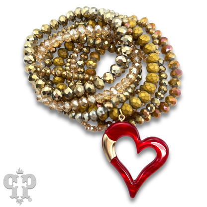 Nine strand bracelet set with red heart charm