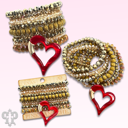 Nine strand bracelet set with red heart charm