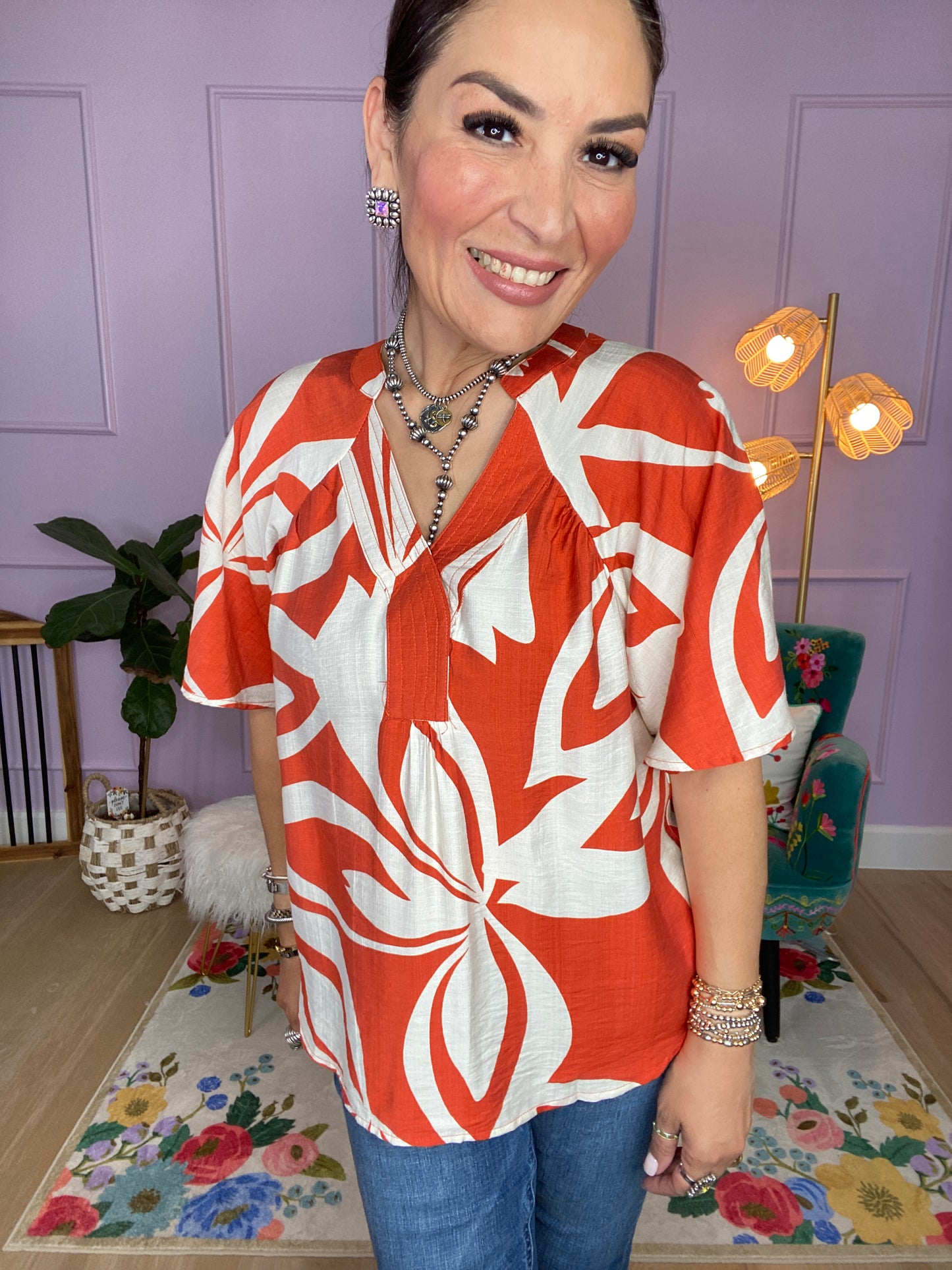Leaf Print V-Neck Top with a Snap Closure and Trapunto Stitching