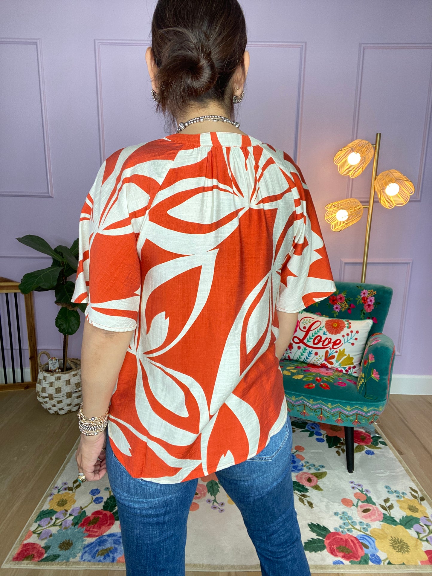 Leaf Print V-Neck Top with a Snap Closure and Trapunto Stitching