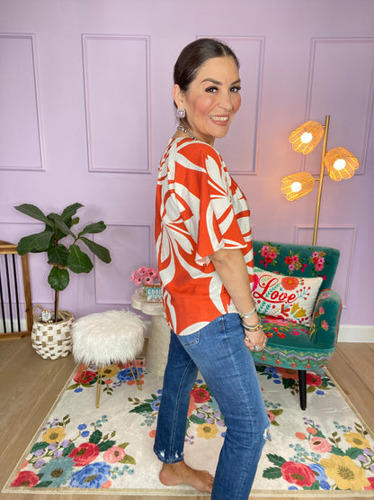 Leaf Print V-Neck Top with a Snap Closure and Trapunto Stitching