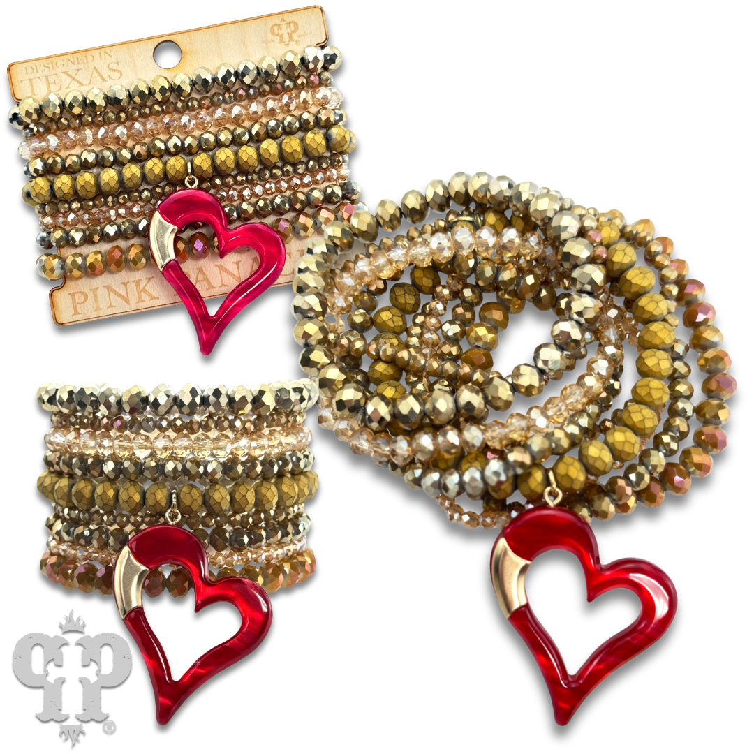 Nine strand bracelet set with red heart charm