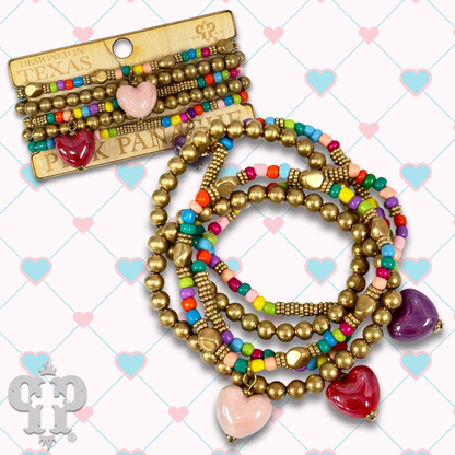 Multi-color bracelet with three heart charms